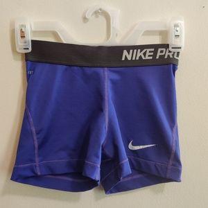 Purple and black Nike Pro shorts